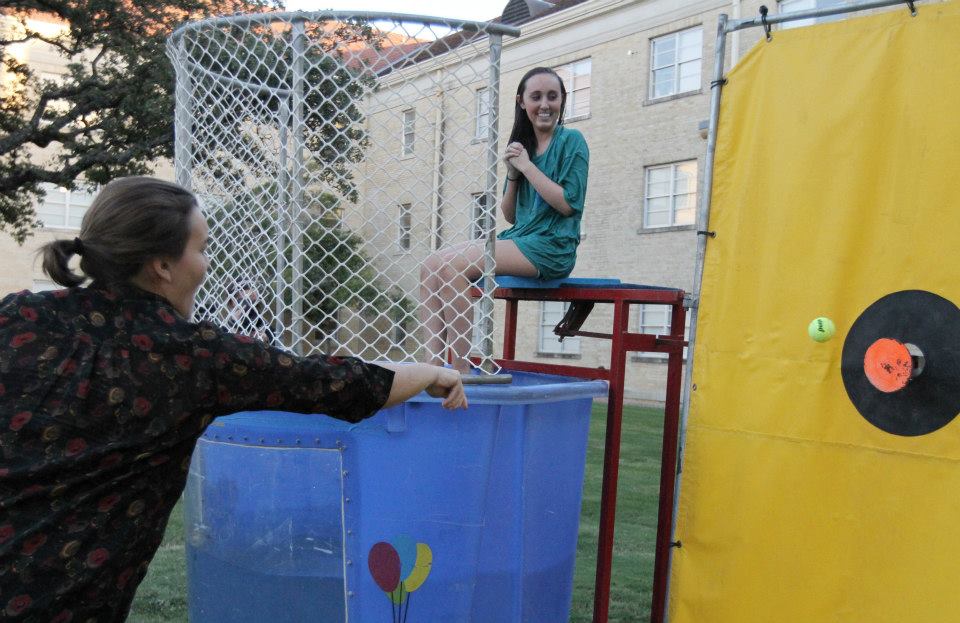 TCU students press their luck at the dunk tank during a university homecomi...